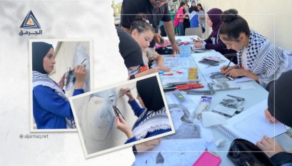 بالفيديو.. العشرات يشاركون في إعادة رسم جدارية شيرين أبو عاقلة في باقة الغربية
